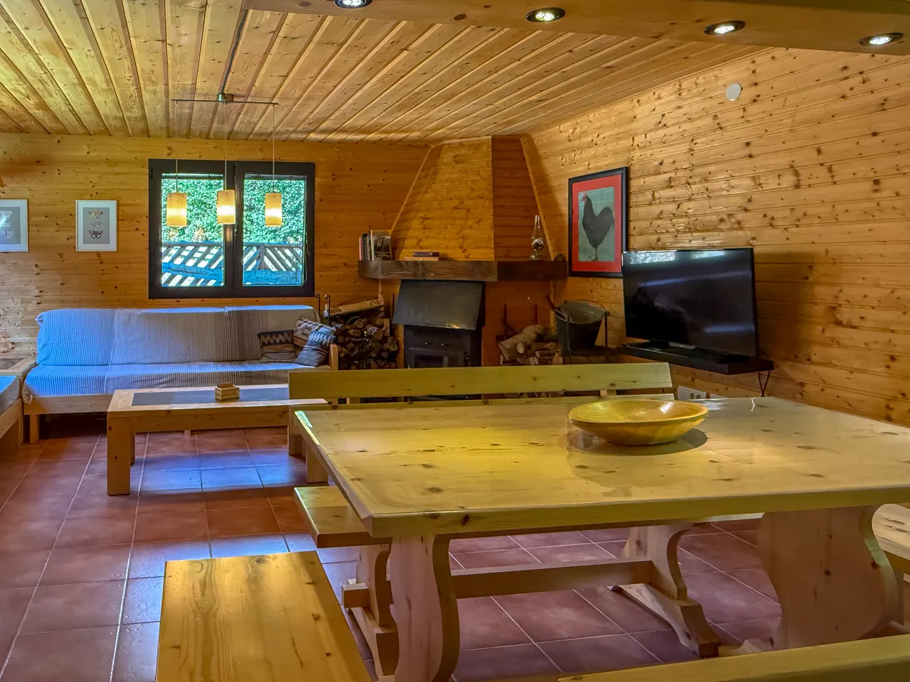 The living area, wood stove and dining table